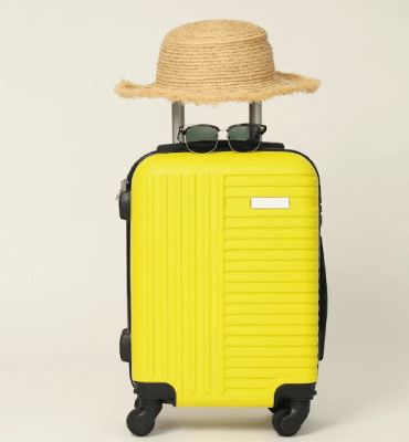 yellow suitcase ready for a cancun trip